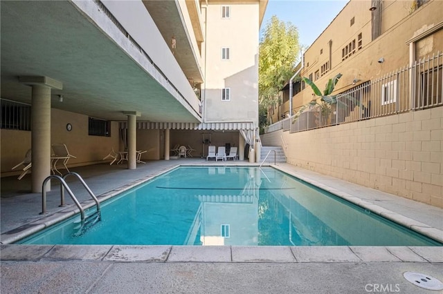 view of swimming pool with a patio area