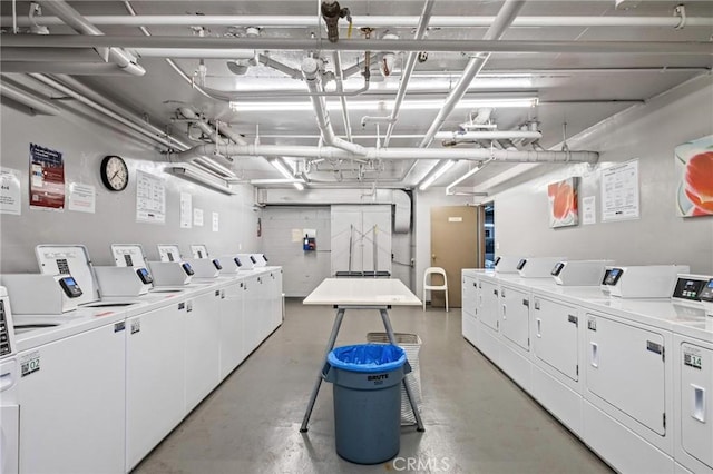 clothes washing area featuring washer and dryer