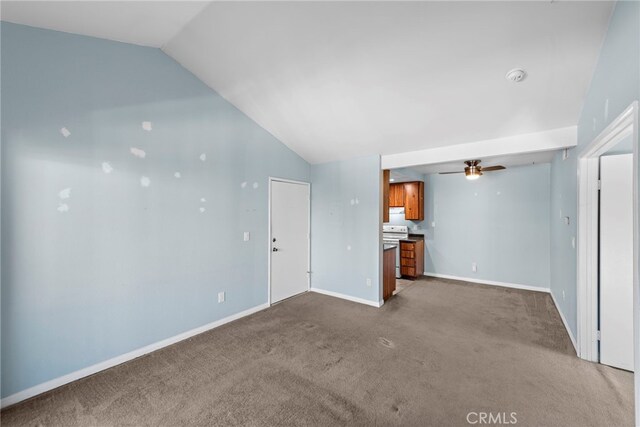 unfurnished living room featuring carpet, ceiling fan, and vaulted ceiling