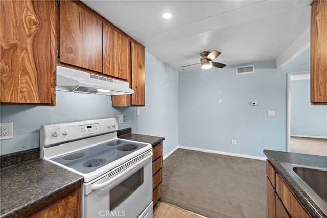 kitchen with white range with electric cooktop, ceiling fan, sink, and light carpet