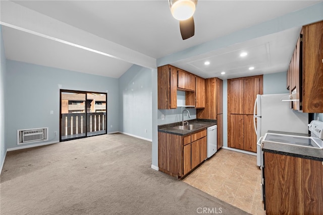 kitchen featuring white dishwasher, ceiling fan, sink, and light carpet