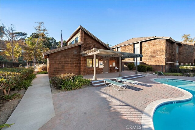 view of swimming pool with a pergola and a patio area