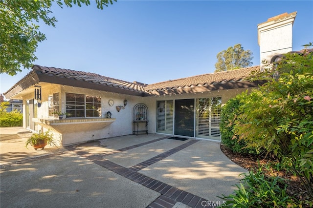 view of front of home with a patio area