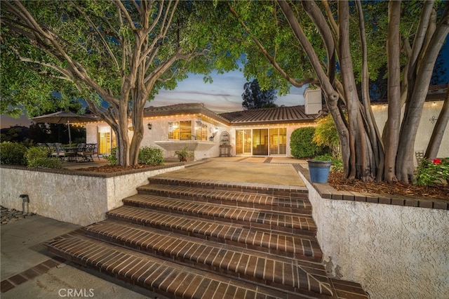 view of front of property with a patio area