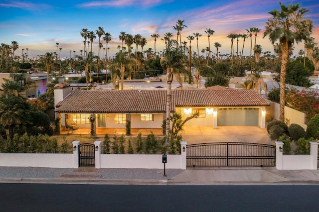 mediterranean / spanish house featuring a garage