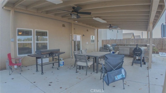 view of patio with grilling area and ceiling fan