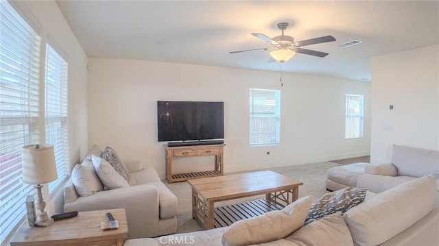 living room with carpet flooring and ceiling fan