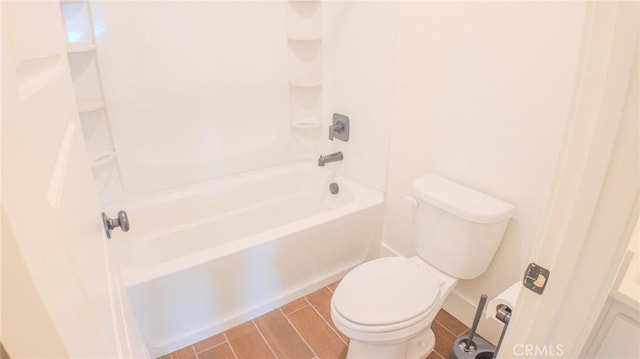 bathroom with shower / tub combination and toilet