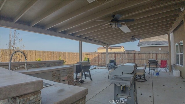 view of patio / terrace with area for grilling, grilling area, and ceiling fan