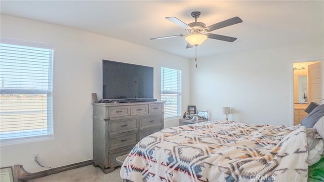 bedroom featuring light colored carpet and ceiling fan