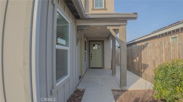 entrance to property with a patio