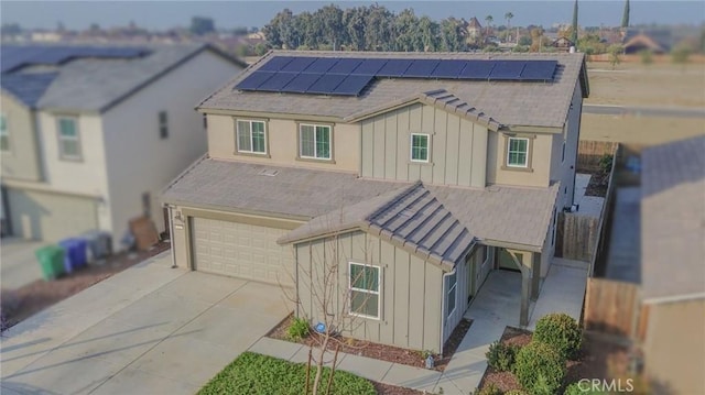 view of front of property with solar panels