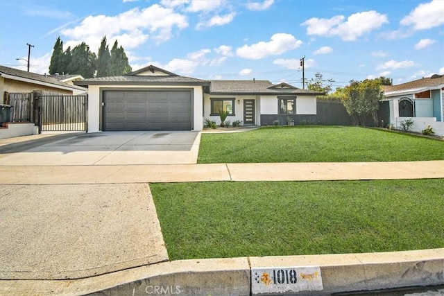 ranch-style home featuring a garage and a front lawn