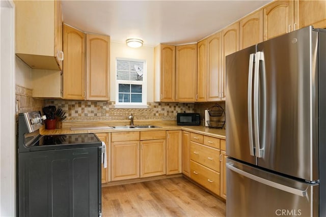 9528 Washington St, Upper Lake, CA 95485 - kitchen featuring light brown cabinetry, black appliances, light countertops, and a sink
