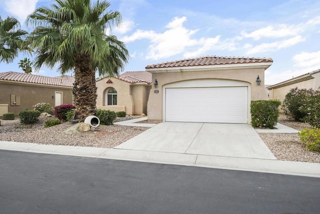 mediterranean / spanish-style home featuring a garage