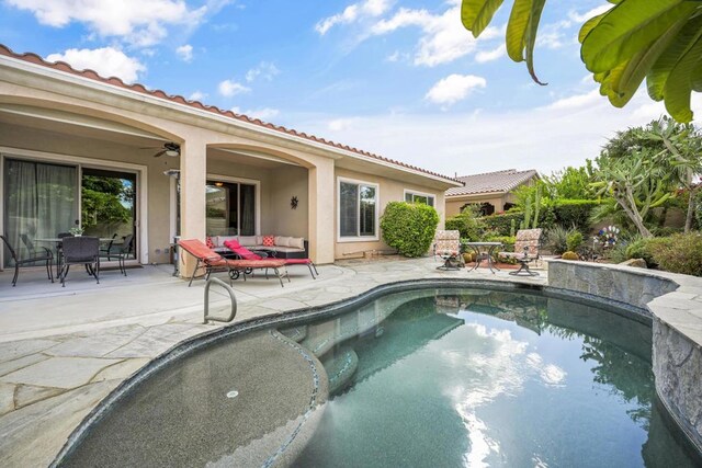 view of pool featuring an outdoor living space, ceiling fan, and a patio