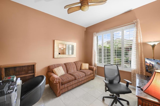 home office featuring light tile patterned floors and ceiling fan