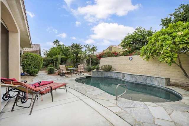 view of swimming pool featuring a patio