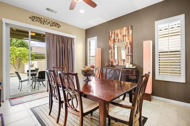 dining area with ceiling fan and light tile patterned flooring