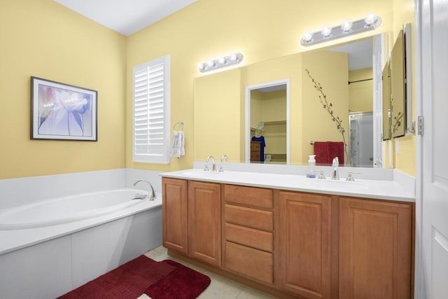 bathroom with vanity, tile patterned floors, and independent shower and bath