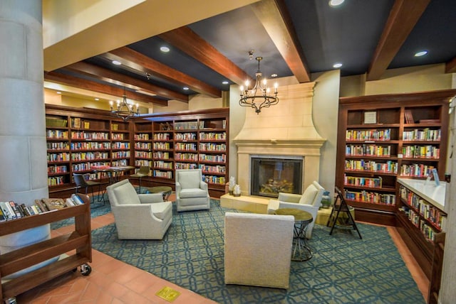 living area with beam ceiling and a fireplace