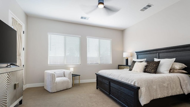 bedroom with ceiling fan, light carpet, multiple windows, and lofted ceiling