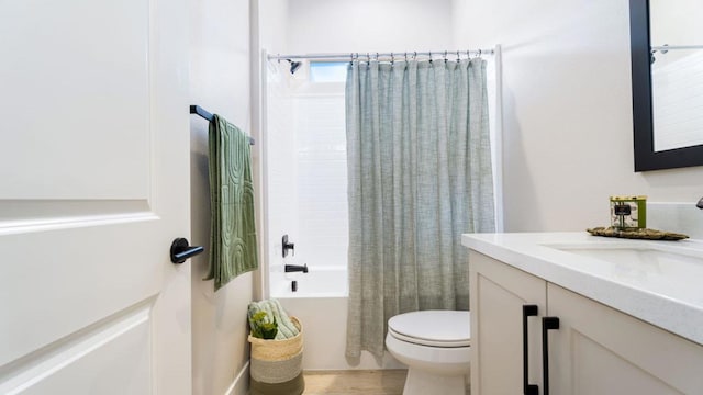 full bathroom featuring toilet, vanity, and shower / bath combo