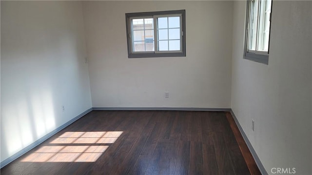 empty room featuring dark hardwood / wood-style floors