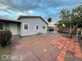 view of property exterior with a patio