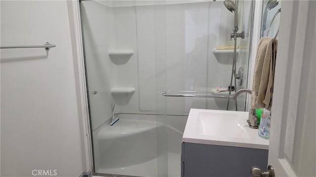 bathroom with vanity and walk in shower