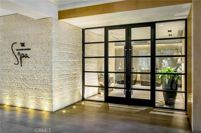 interior space featuring hardwood / wood-style flooring and ornamental molding