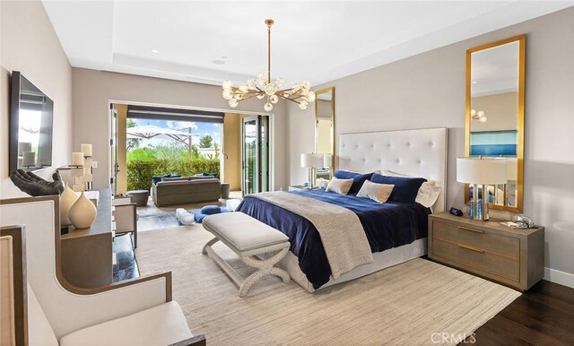 51 Monarch Beach Resort S, Dana Point, CA 92629 - bedroom featuring access to outside, wood finished floors, and a chandelier