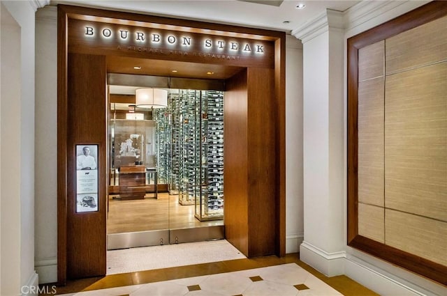 wine area featuring tile patterned floors