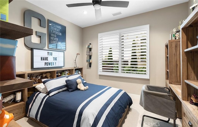 bedroom with light colored carpet and ceiling fan