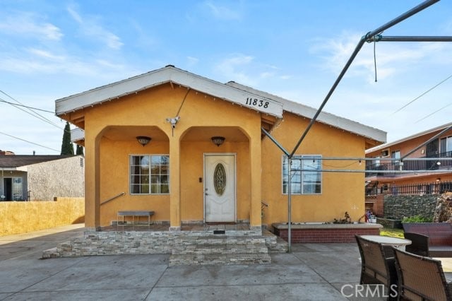 bungalow-style home featuring a patio area