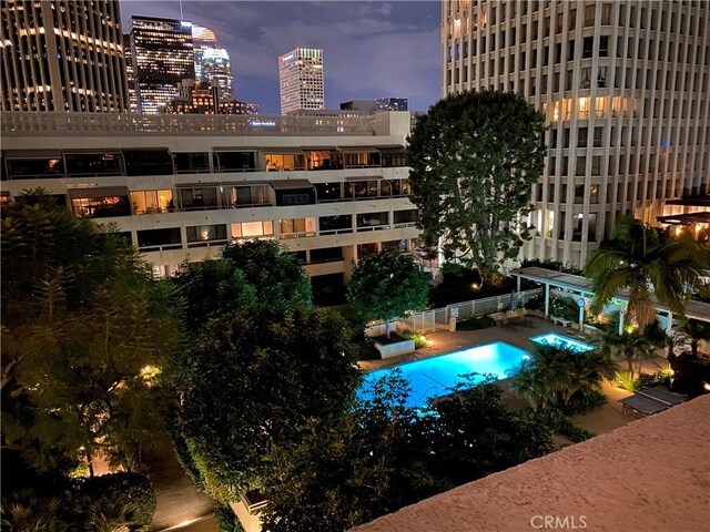 view of pool at dusk