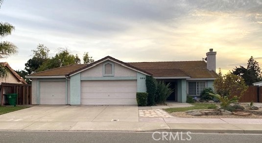 single story home featuring a garage