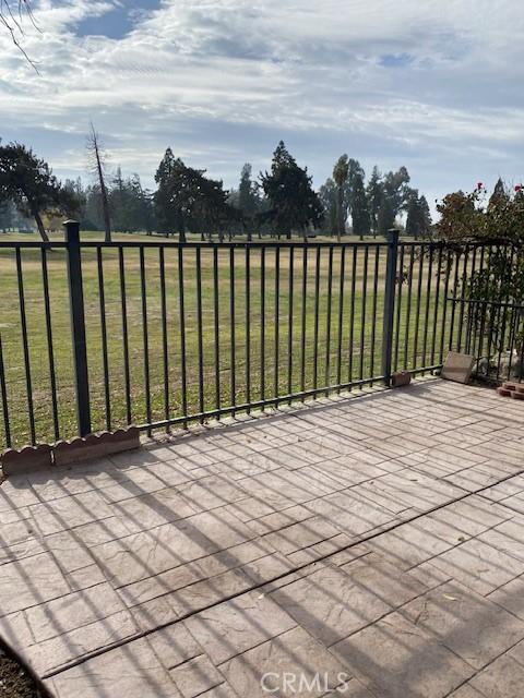 wooden deck featuring a lawn