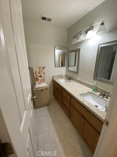 bathroom featuring tile patterned floors and vanity