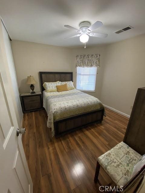 bedroom featuring ceiling fan and dark hardwood / wood-style flooring