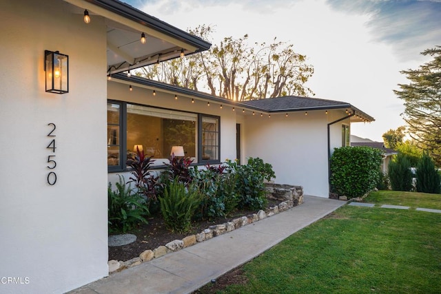 view of home's exterior featuring a yard