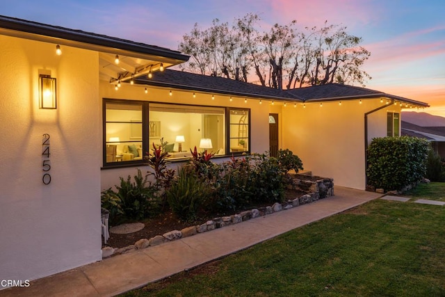 view of front of house with a yard