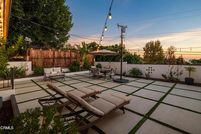 view of patio terrace at dusk