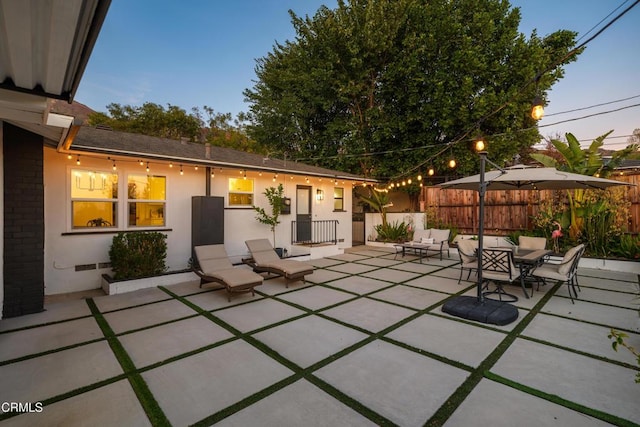 patio terrace at dusk with outdoor lounge area