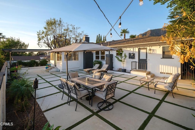 back of house with a patio