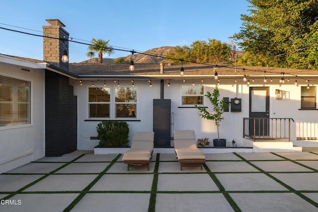 rear view of house featuring a patio