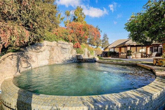 view of pool featuring a patio