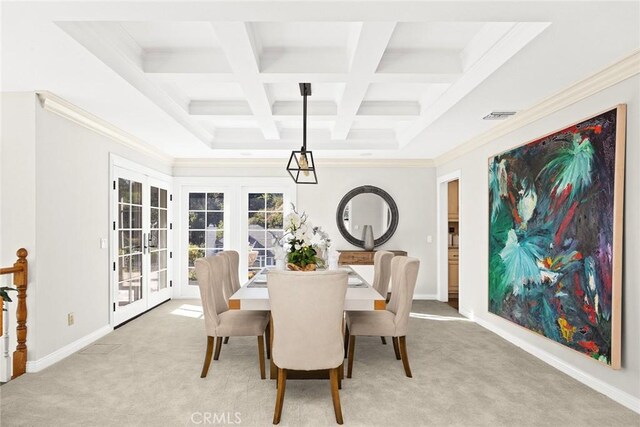 carpeted dining area featuring coffered ceiling, ornamental molding, beam ceiling, and french doors