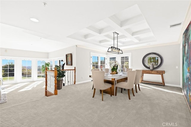 dining space featuring beamed ceiling, crown molding, coffered ceiling, light carpet, and french doors