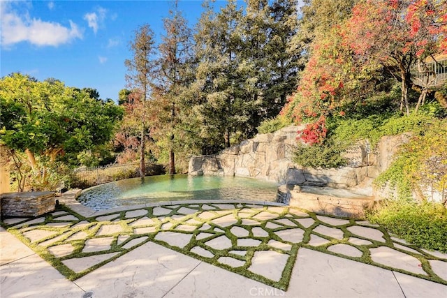 view of property's community with a patio